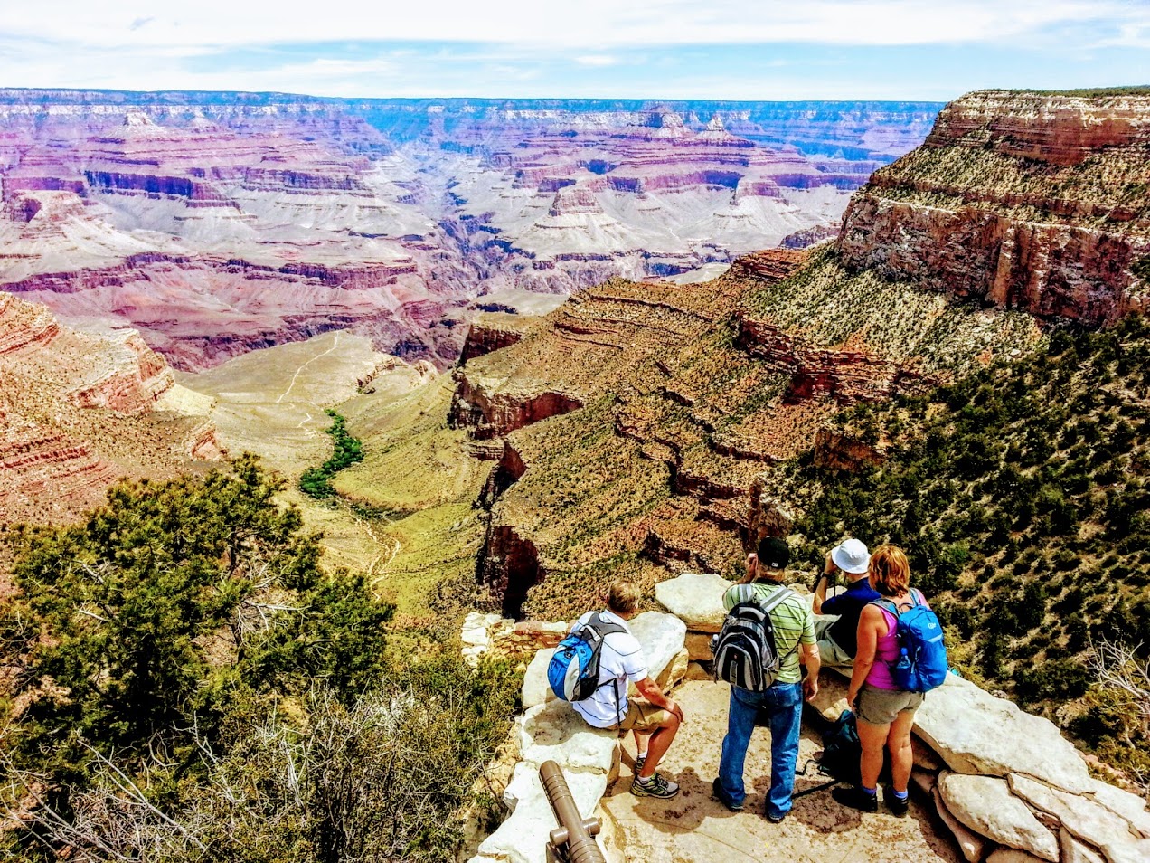 Visitors taking in sweeping panoramic vistas at the Grand Canyon South Rim