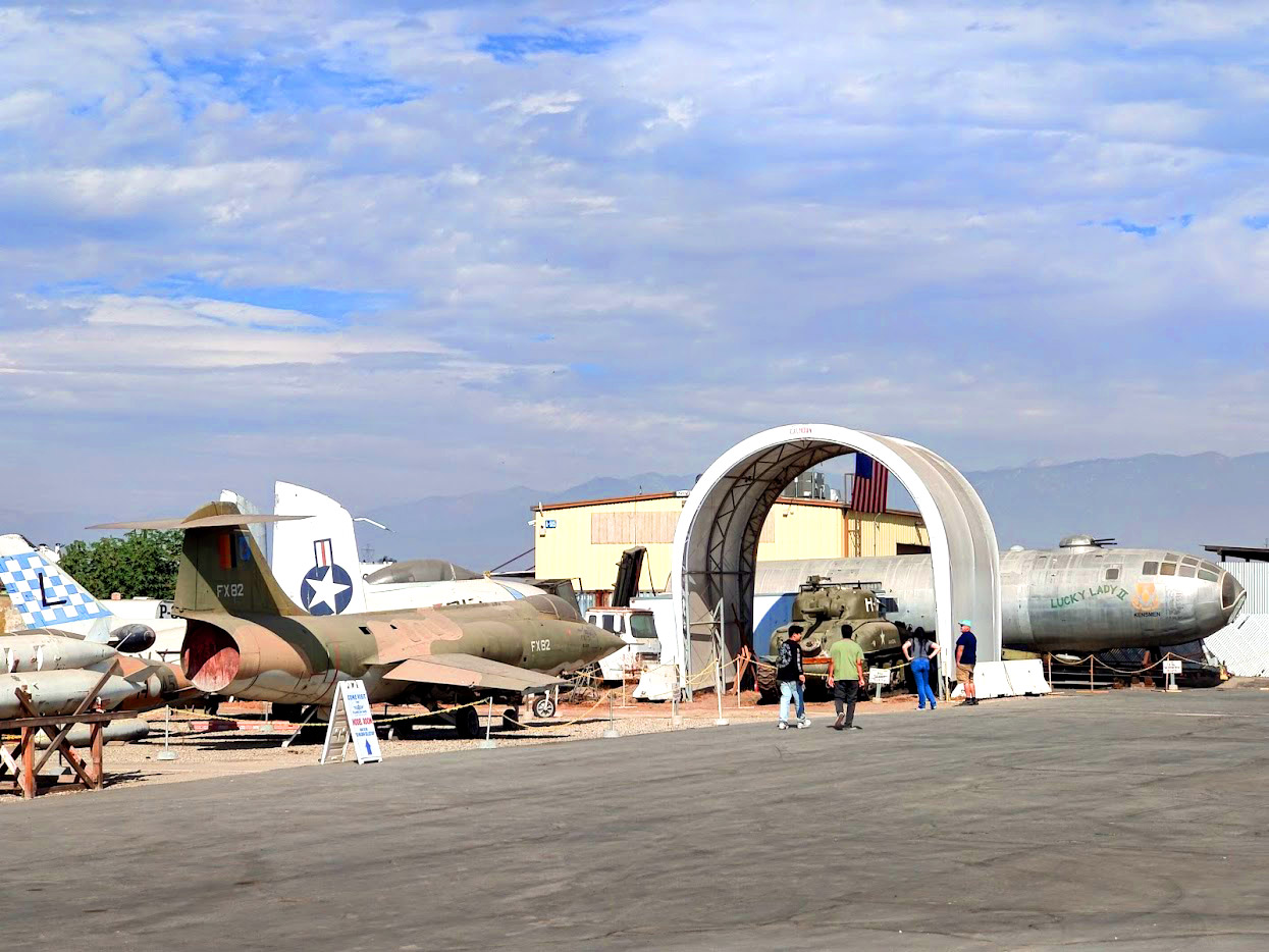 Historic military aircraft and aviation displays on the outdoor field at the Planes of Fame Air Museum