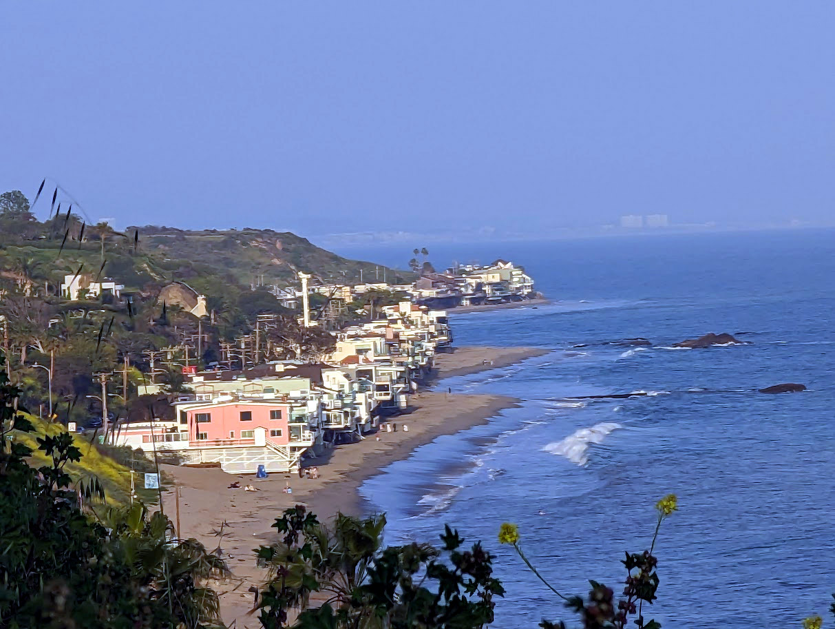 Malibu coastline with Pacific Ocean waves crashing on the shore