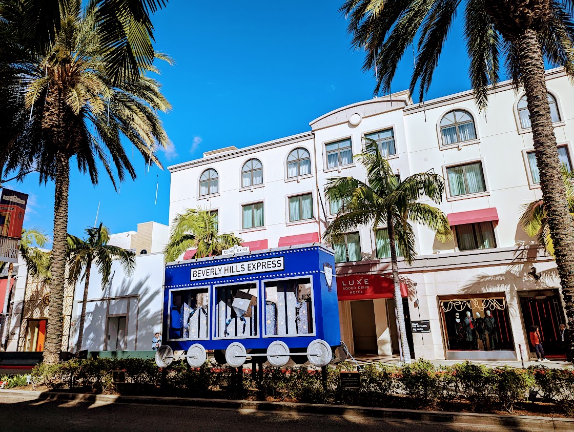Rodeo Drive pedestrian sidewalk and luxury boutique storefronts