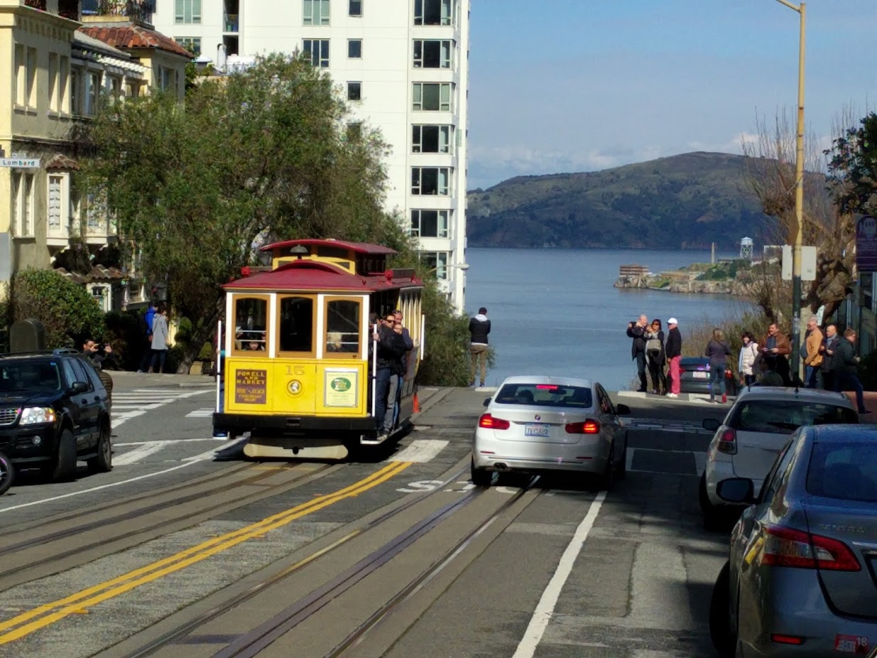 Historic San Francisco Cable Car climbing steep city street